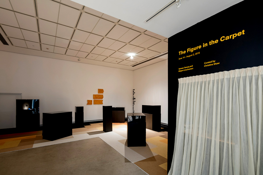 Photograph of the installation with the curtained entrance in the shot.