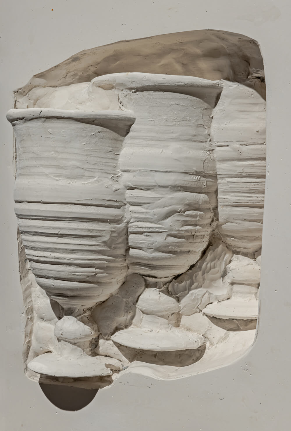 Close up of a recessed area with three goblets.