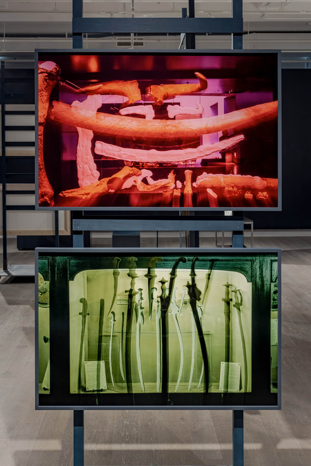 A red print of bones hanging above a green print of daggers.