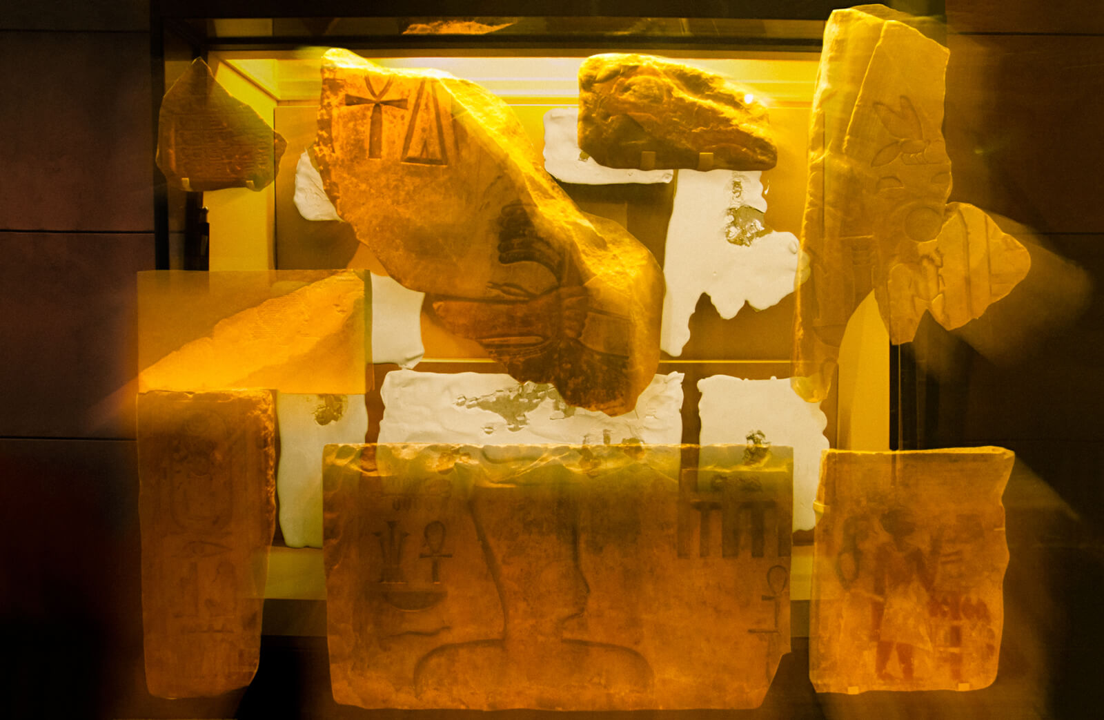 Collaged pieces of tablets with hieroglyphs.